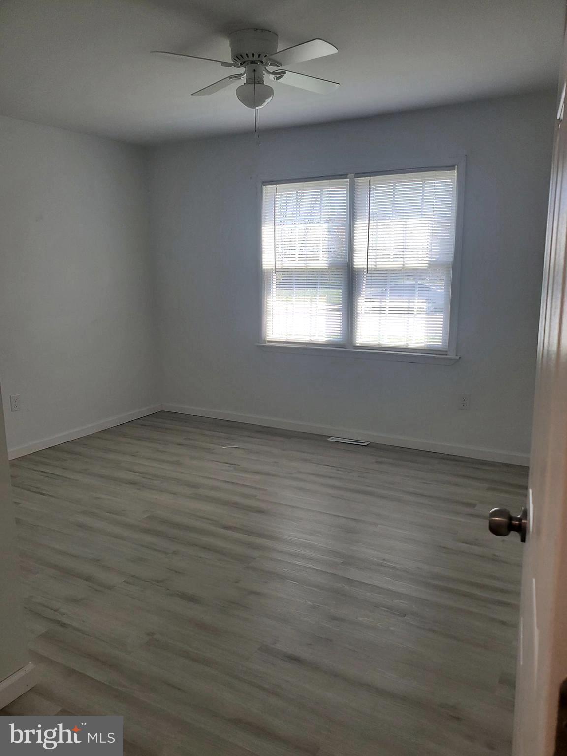 112 Holmes Street Dover, DE 19901 - Photo 12 of 24 an empty room with a window