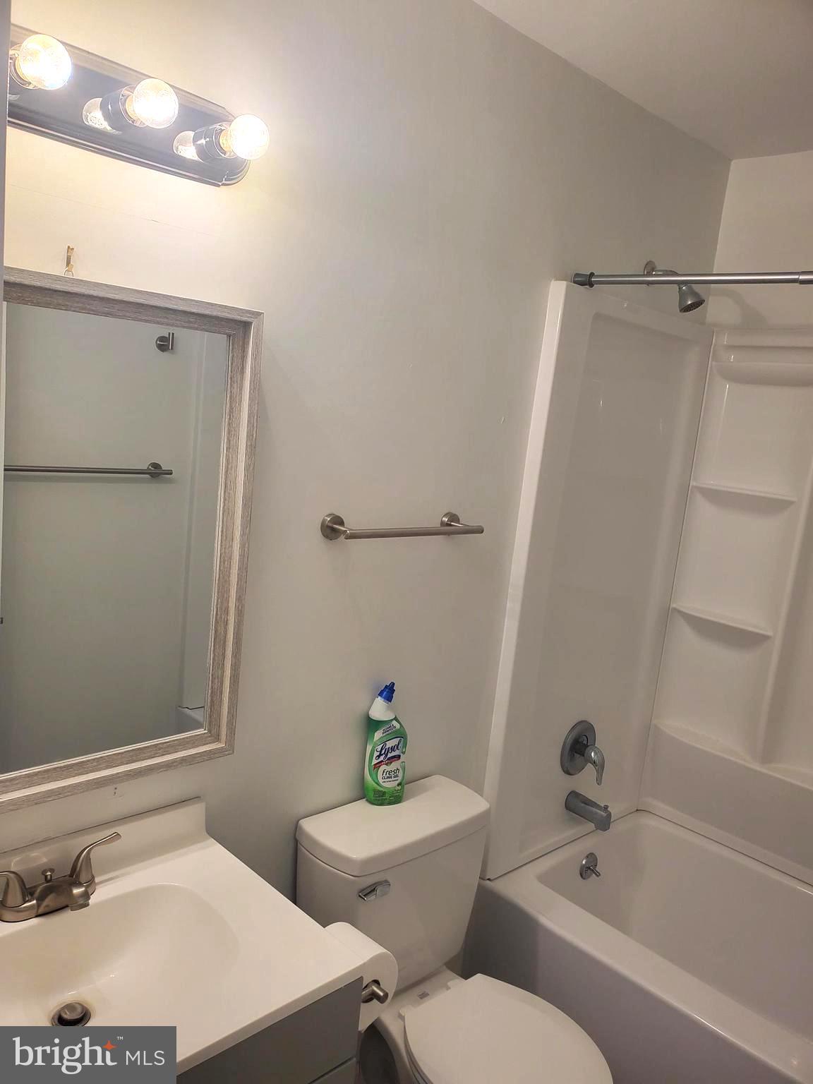 112 Holmes Street Dover, DE 19901 - Photo 13 of 24 a bathroom with a sink and a mirror