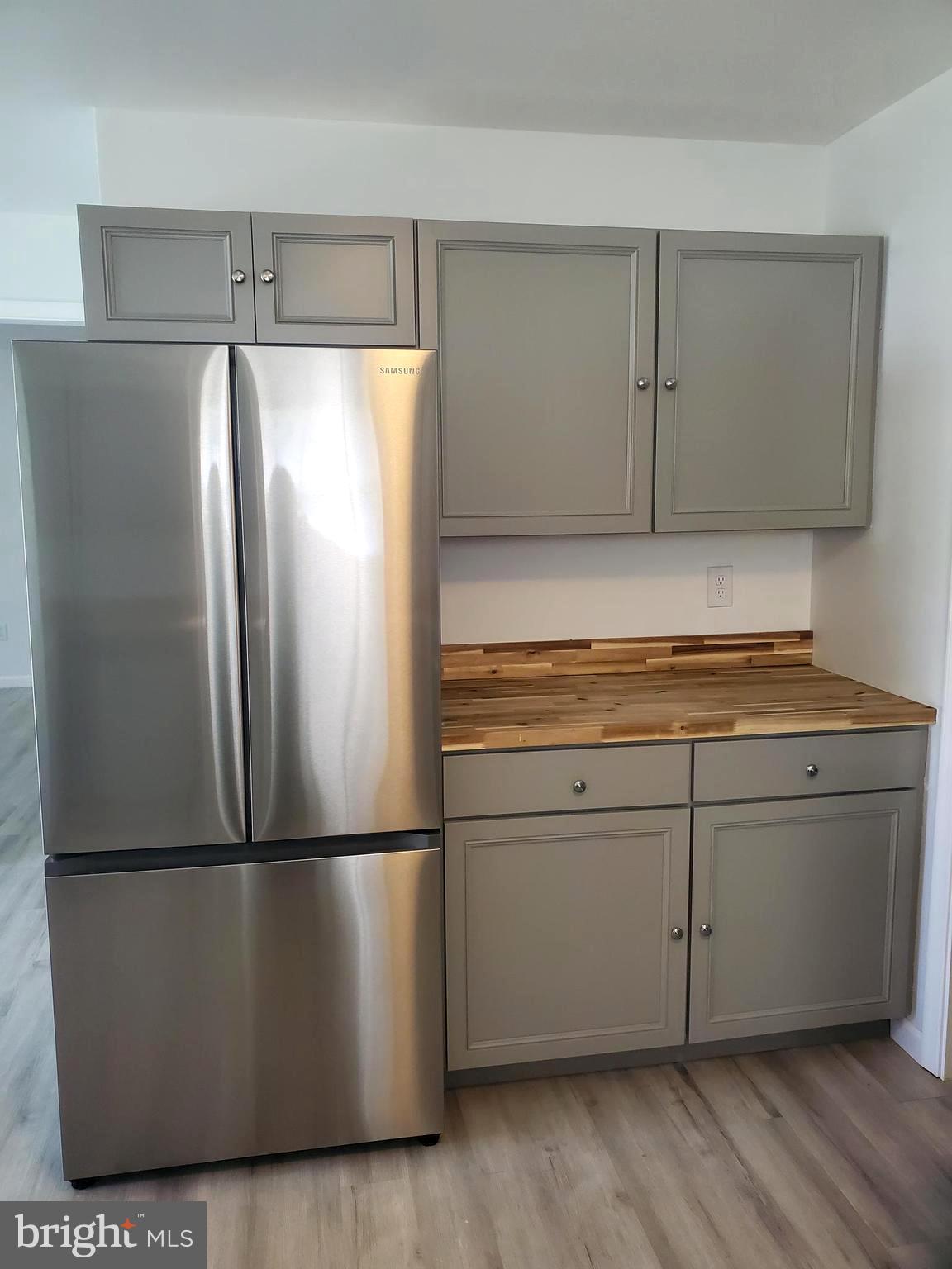 112 Holmes Street Dover, DE 19901 - Photo 4 of 24 a kitchen with cabinets and stainless steel appliances