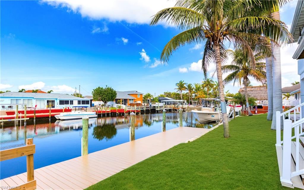 12277 Boat Shell Drive Matlacha Isles, FL 33991 - Photo 24 of 46 a view of a swimming pool with lounge chairs