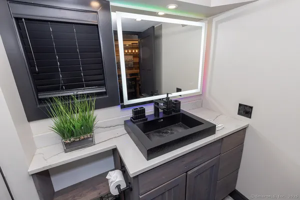 a large kitchen with stainless steel appliances lots of counter space and wooden floor