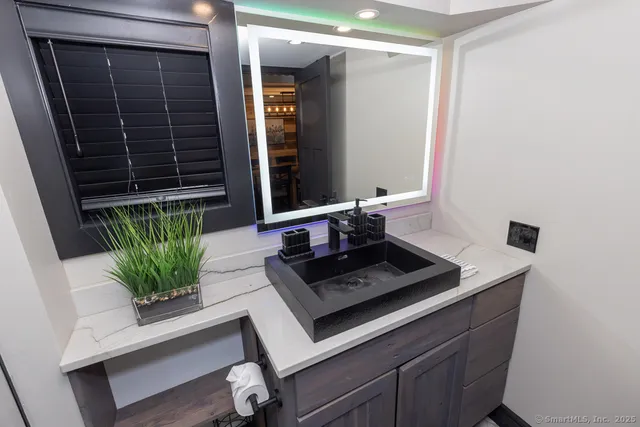 a large kitchen with stainless steel appliances lots of counter space and wooden floor