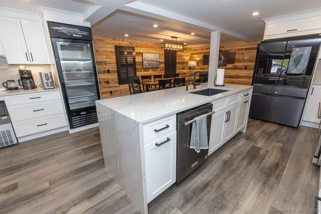 a stove top oven sitting inside of a kitchen