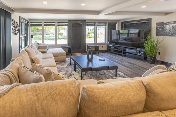 a living room with furniture or couch and a window