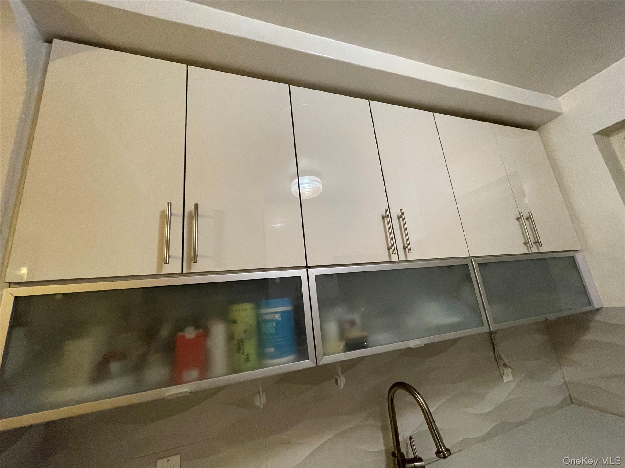 63-60 102nd Street, Unit D7 Queens, NY 11374 - Photo 39 of 41 Kitchen view of modern cabinets and white cabinetry