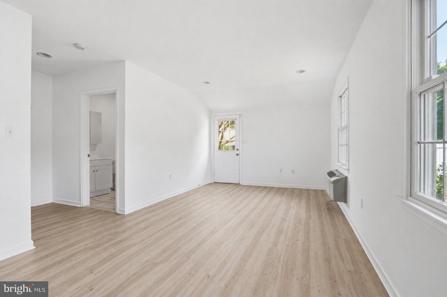 220 Solway Road Lutherville-Timonium, MD 21093 - Photo 26 of 38 wooden floor in an empty room with a window