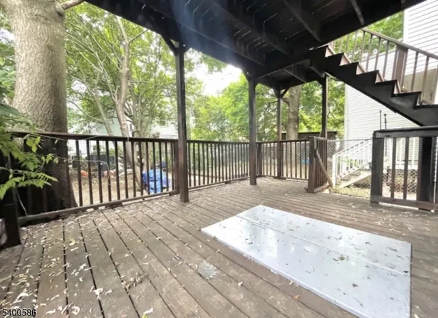a view of a balcony with wooden floor