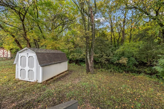 a view of a tiny house with a yard