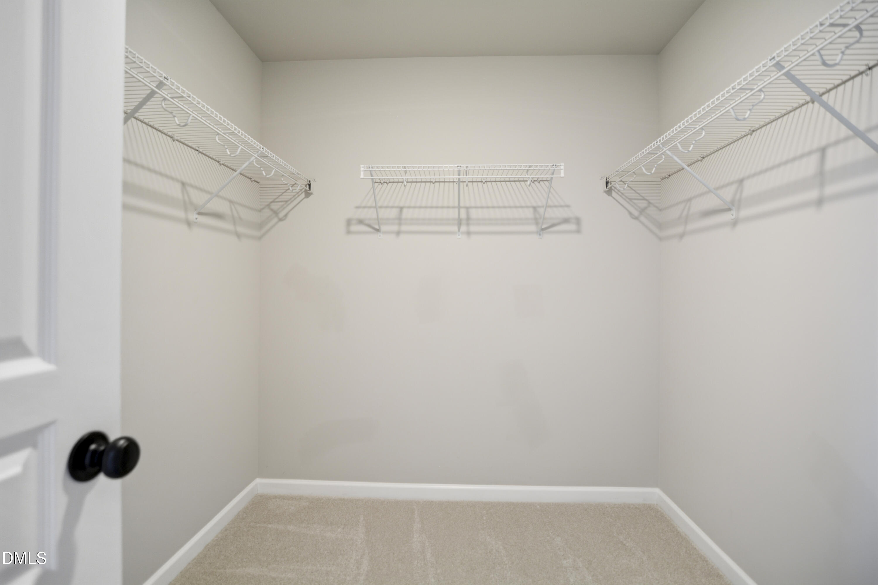 5916 Giddings Street Raleigh, NC 27616 - Photo 19 of 49 a view of a store room with racks on the wall