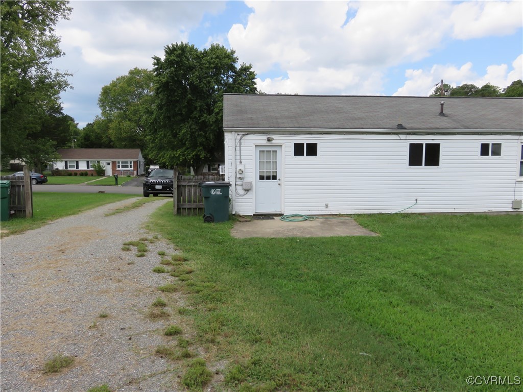 9809 Durango Road Henrico, VA 23228 - Photo 16 of 19 a view of a white house in front of a big yard with large trees