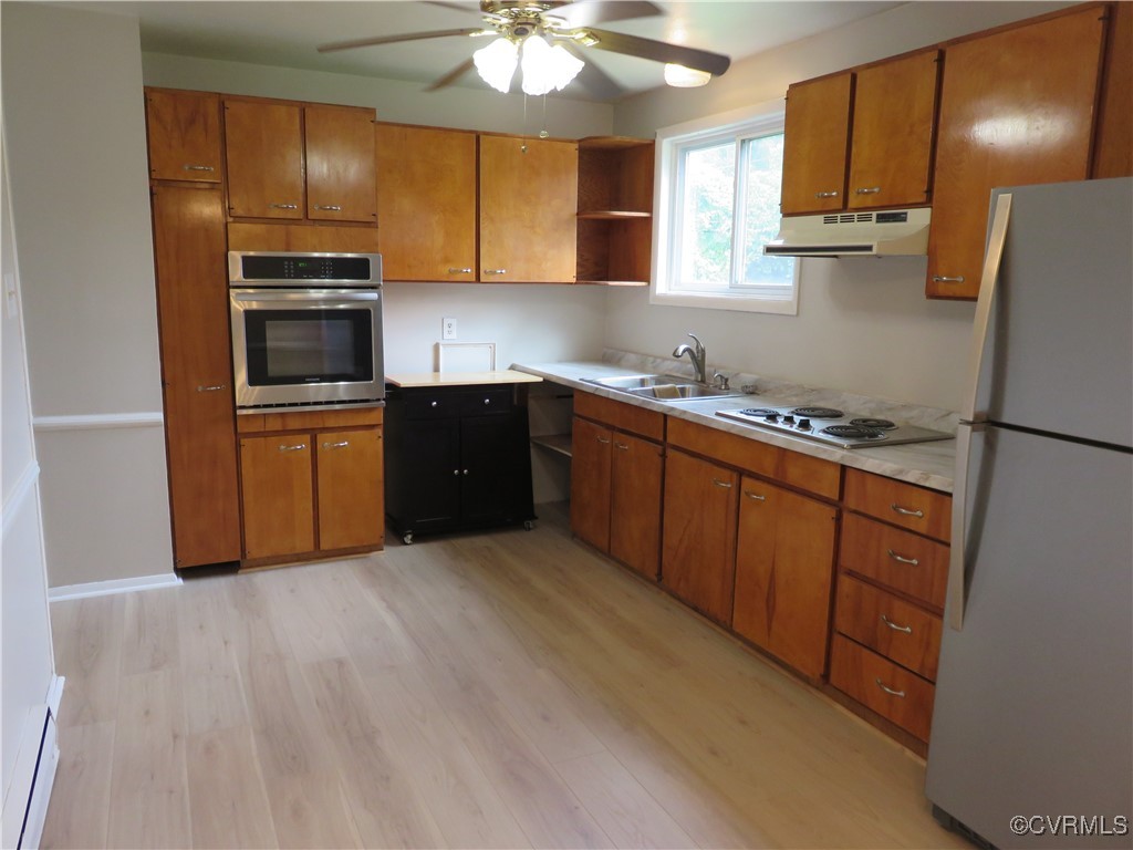 9809 Durango Road Henrico, VA 23228 - Photo 8 of 19 a kitchen with stainless steel appliances granite countertop a sink stove and refrigerator