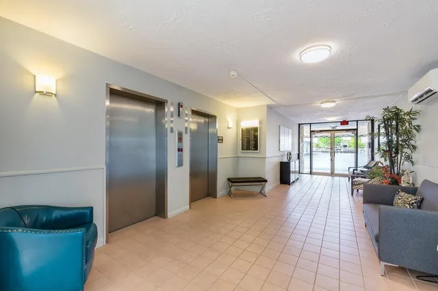 a large bedroom with a large bed and furniture