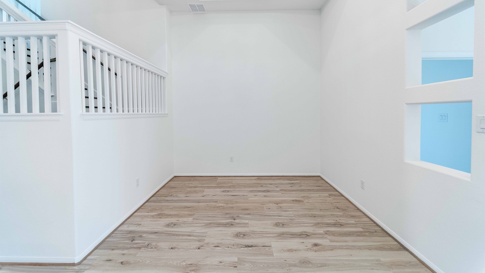 294 Rubber Tree Way Buda, TX 78610 - Photo 14 of 19 Spare room featuring light wood-style floors and baseboards