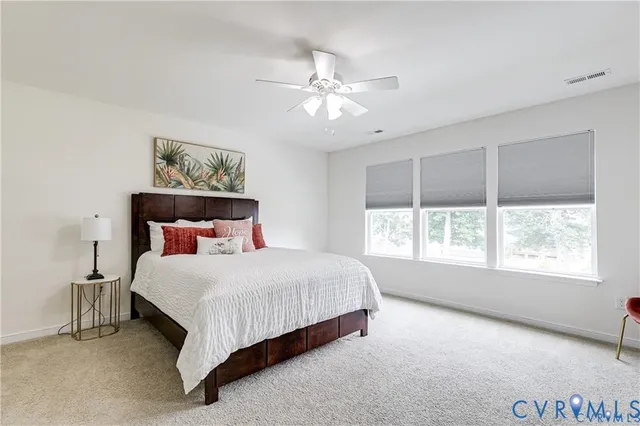 a bedroom with bed and window