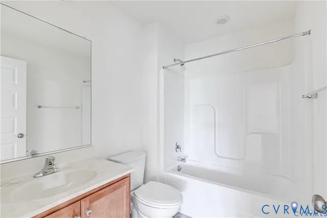 a bedroom with a bed and a ceiling fan