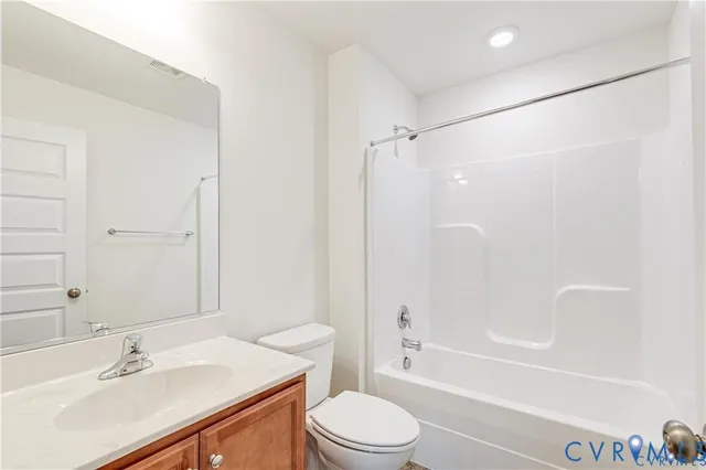 a view of a backyard with potted plants and wooden fence