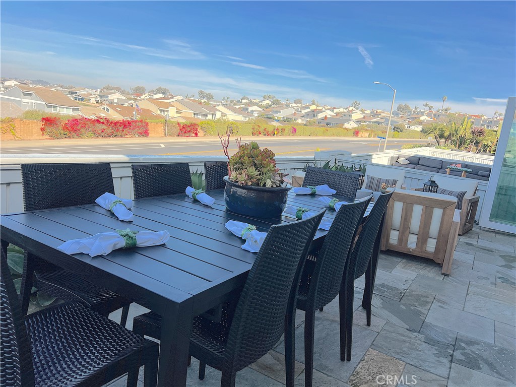 24105 Gourami Bay Dana Point, CA 92629 - Photo 20 of 56 a view of a dining table and chairs in the balcony