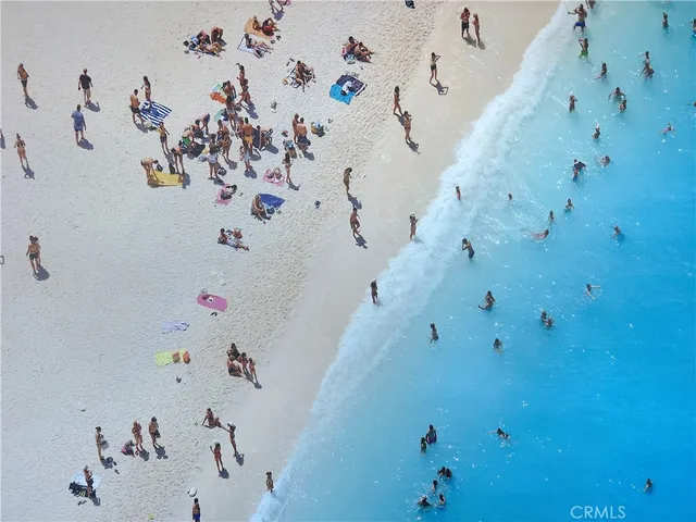 a kitchen with a table chairs and white cabinets