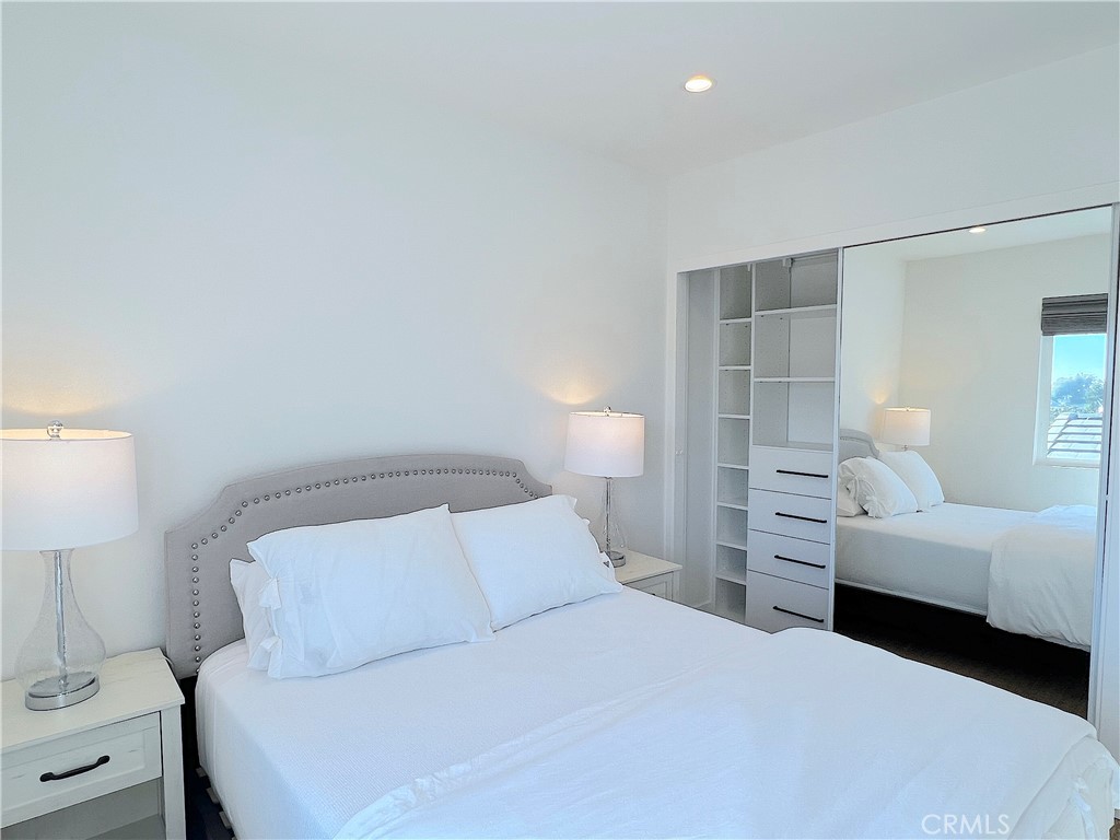 24105 Gourami Bay Dana Point, CA 92629 - Photo 45 of 56 a bedroom with a bed and a lamp