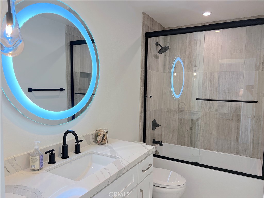 24105 Gourami Bay Dana Point, CA 92629 - Photo 46 of 56 a bathroom with a sink a toilet and a mirror