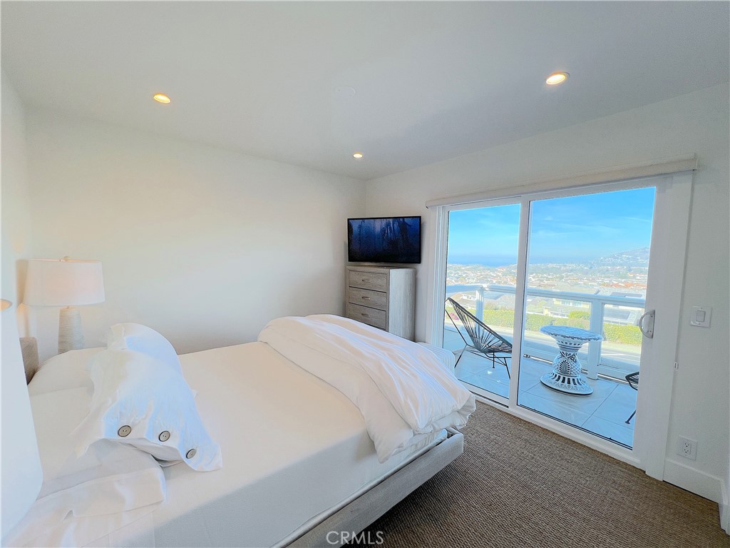 24105 Gourami Bay Dana Point, CA 92629 - Photo 47 of 56 a bedroom with a bed and large window