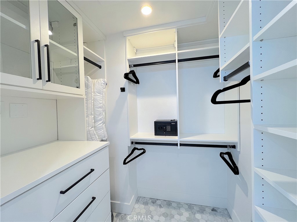 24105 Gourami Bay Dana Point, CA 92629 - Photo 56 of 56 a bathroom with a sink and a mirror