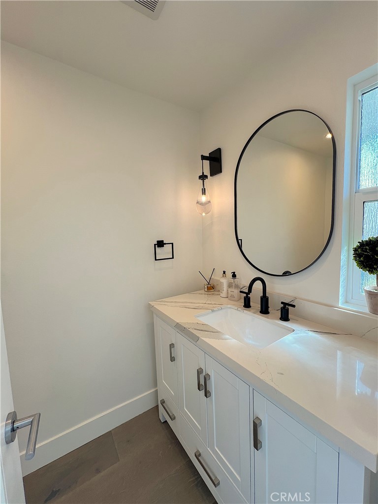 24105 Gourami Bay Dana Point, CA 92629 - Photo 7 of 56 a bathroom with a sink and a mirror