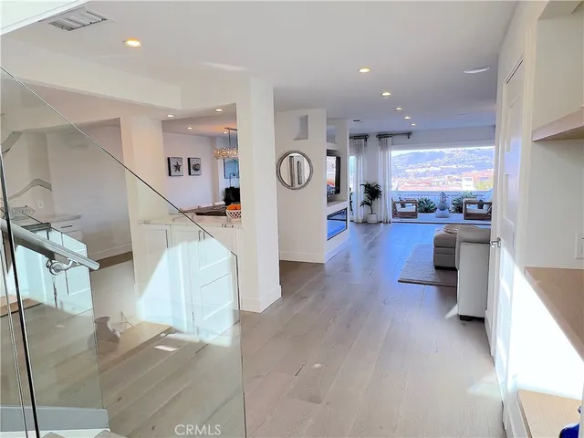 a view of a room with table and chairs