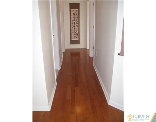 30 Carnation Road Monroe Township, NJ 08831 - Photo 11 of 20 a view of a hallway with wooden floor