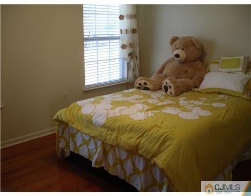 30 Carnation Road Monroe Township, NJ 08831 - Photo 12 of 20 a bed sitting in a bedroom next to a window