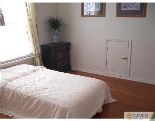 30 Carnation Road Monroe Township, NJ 08831 - Photo 13 of 20 a bedroom with a bed and a potted plant