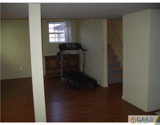 30 Carnation Road Monroe Township, NJ 08831 - Photo 16 of 20 a view of a livingroom with furniture and wooden floor