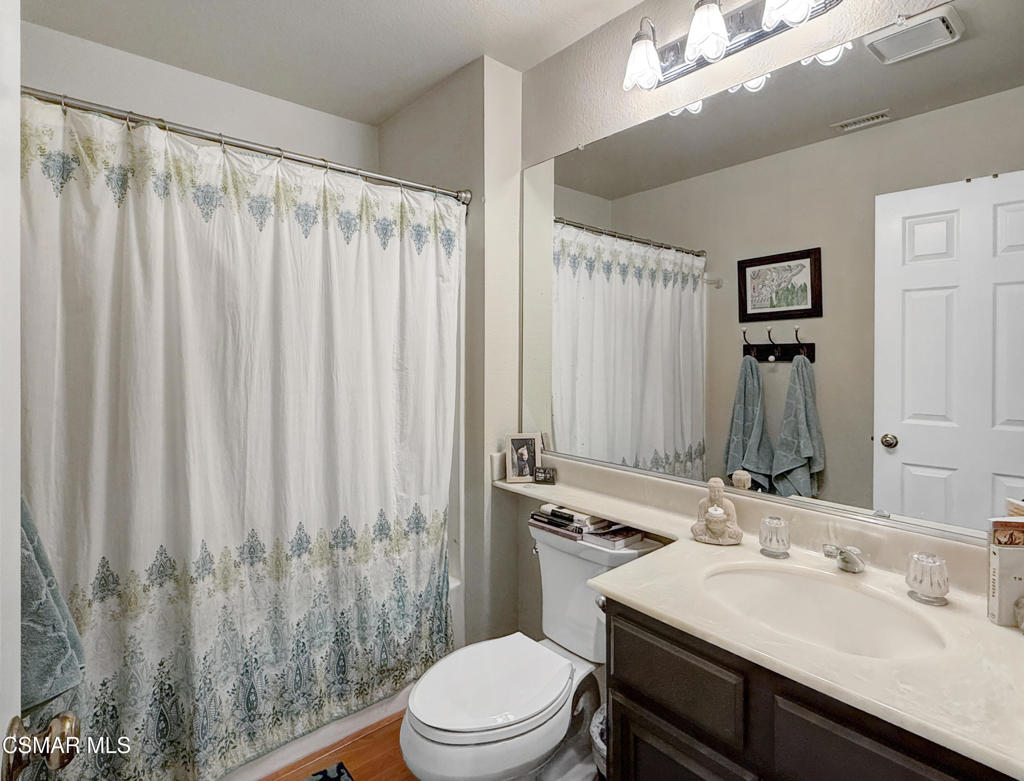264 Ridgeton Lane, Unit B Simi Valley, CA 93065 - Photo 30 of 32 a bathroom with a sink a toilet and shower