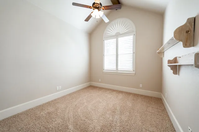 a bathroom with a granite countertop bathtub shower sink mirror vanity and toilet