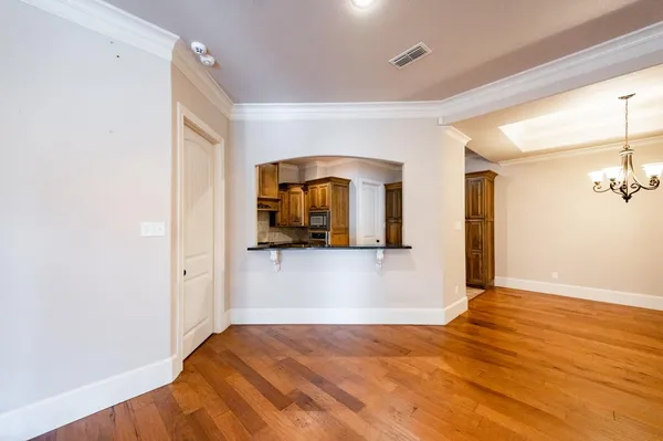 a view of a room with wooden floor and staircase