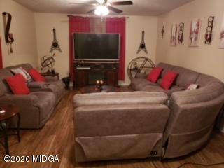 245 Pope Road Roberta, GA 31078 - Photo 3 of 8 a living room with furniture and a flat screen tv