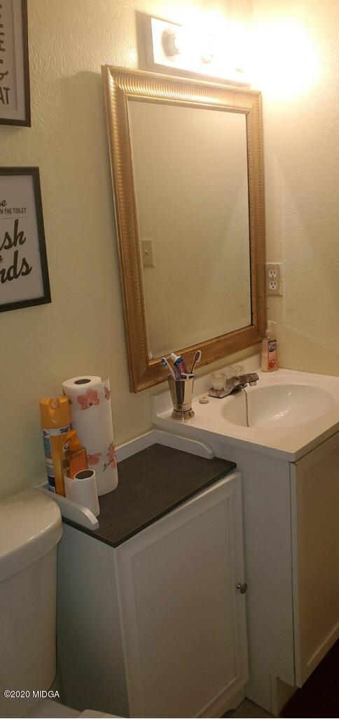 245 Pope Road Roberta, GA 31078 - Photo 8 of 8 a bathroom with a sink and a mirror