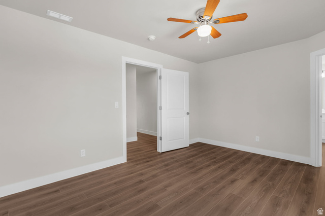 576 7th Avenue Midvale, UT 84047 - Photo 12 of 32 Unfurnished room featuring dark wood-style flooring and ceiling fan