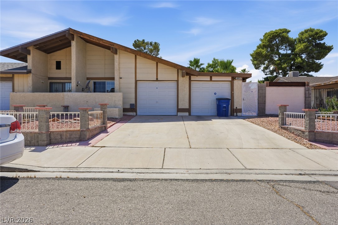 3971 Spring Leaf Drive Las Vegas, NV 89147 - Photo 46 of 48 A well-maintained facade features a distinctive roofline and a practical two-car garage.