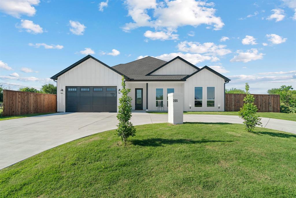 205 Altamesa Boulevard Fort Worth, TX 76134 - Photo 1 of 1 Modern inspired farmhouse with board and batten siding, driveway, an attached garage, and roof with shingles