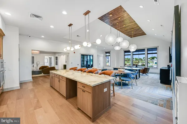 a large kitchen with a table and chairs in it