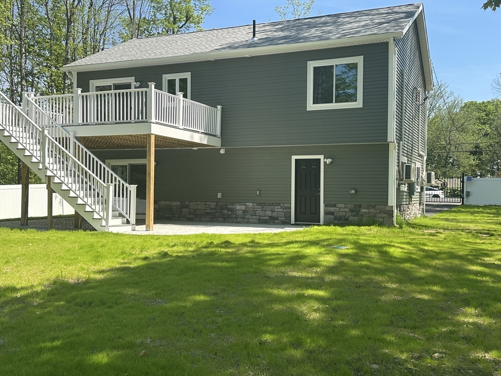 102 Wells Road Becket, MA 01223 - Photo 7 of 40 a front view of a house with a yard