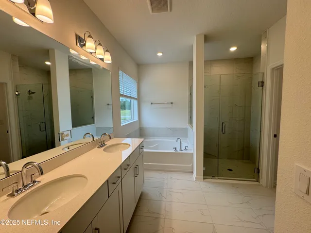 a room with water heater and a refrigerator