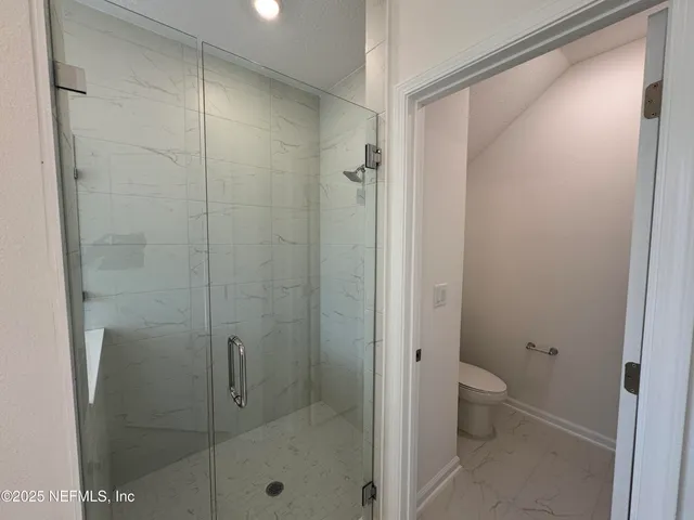 a view of a garden from a balcony