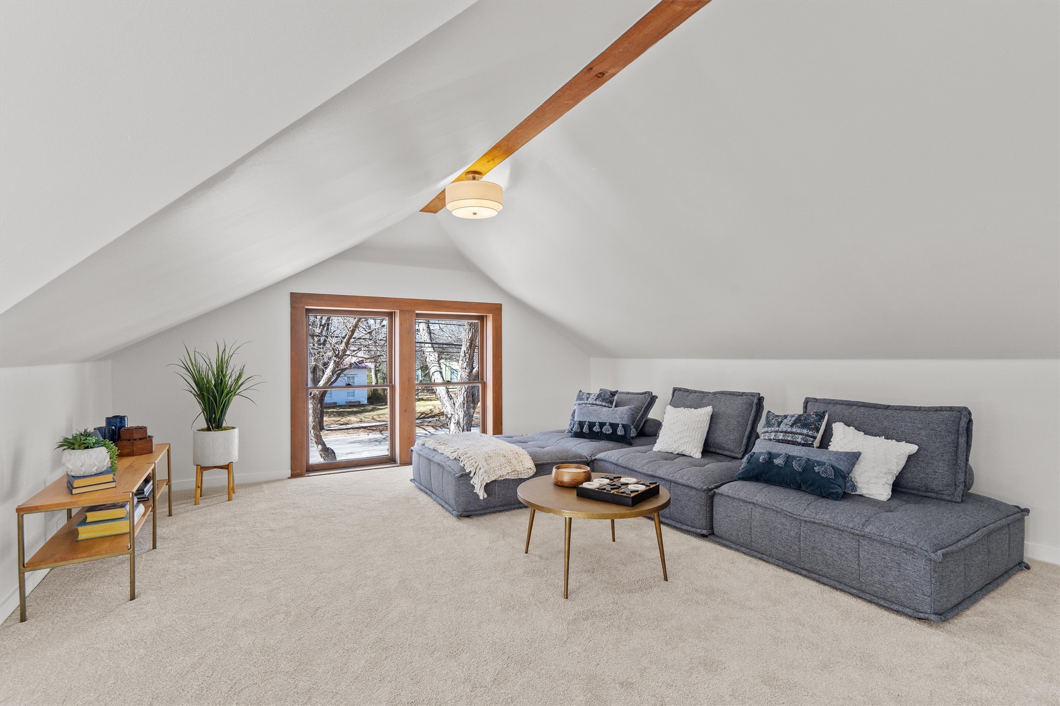 1605 South Austin Avenue Georgetown, TX 78626 - Photo 23 of 40 Living room featuring carpet and vaulted ceiling