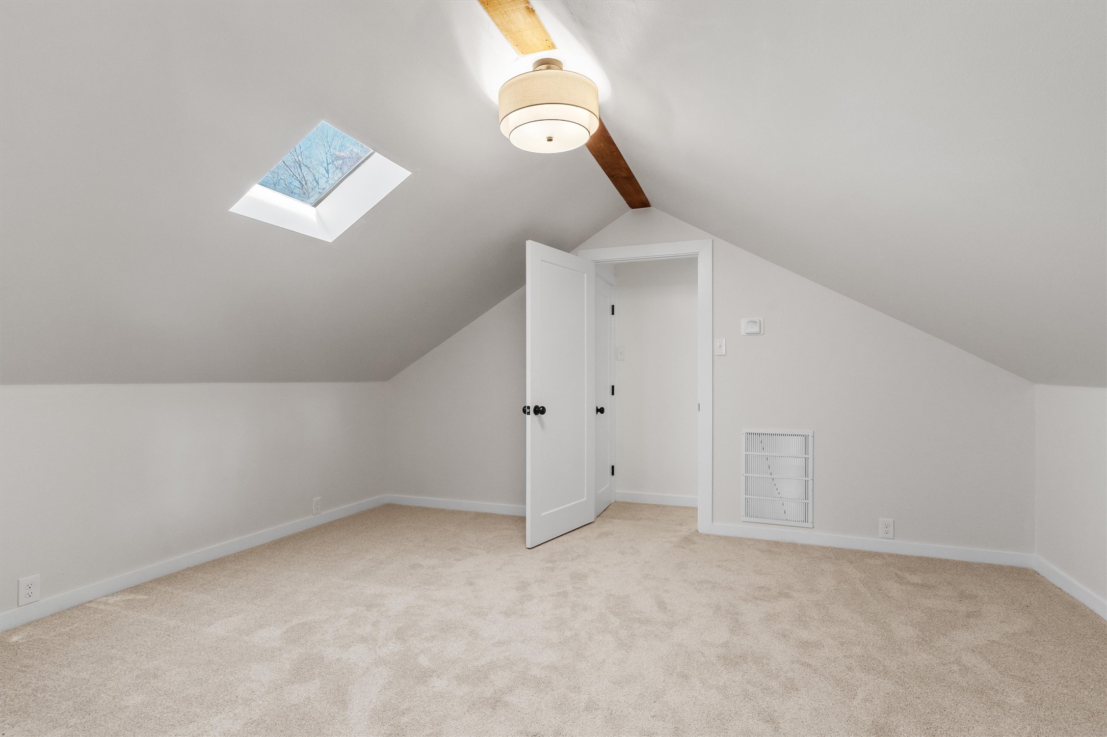 1605 South Austin Avenue Georgetown, TX 78626 - Photo 25 of 40 Bonus room with light colored carpet and a skylight