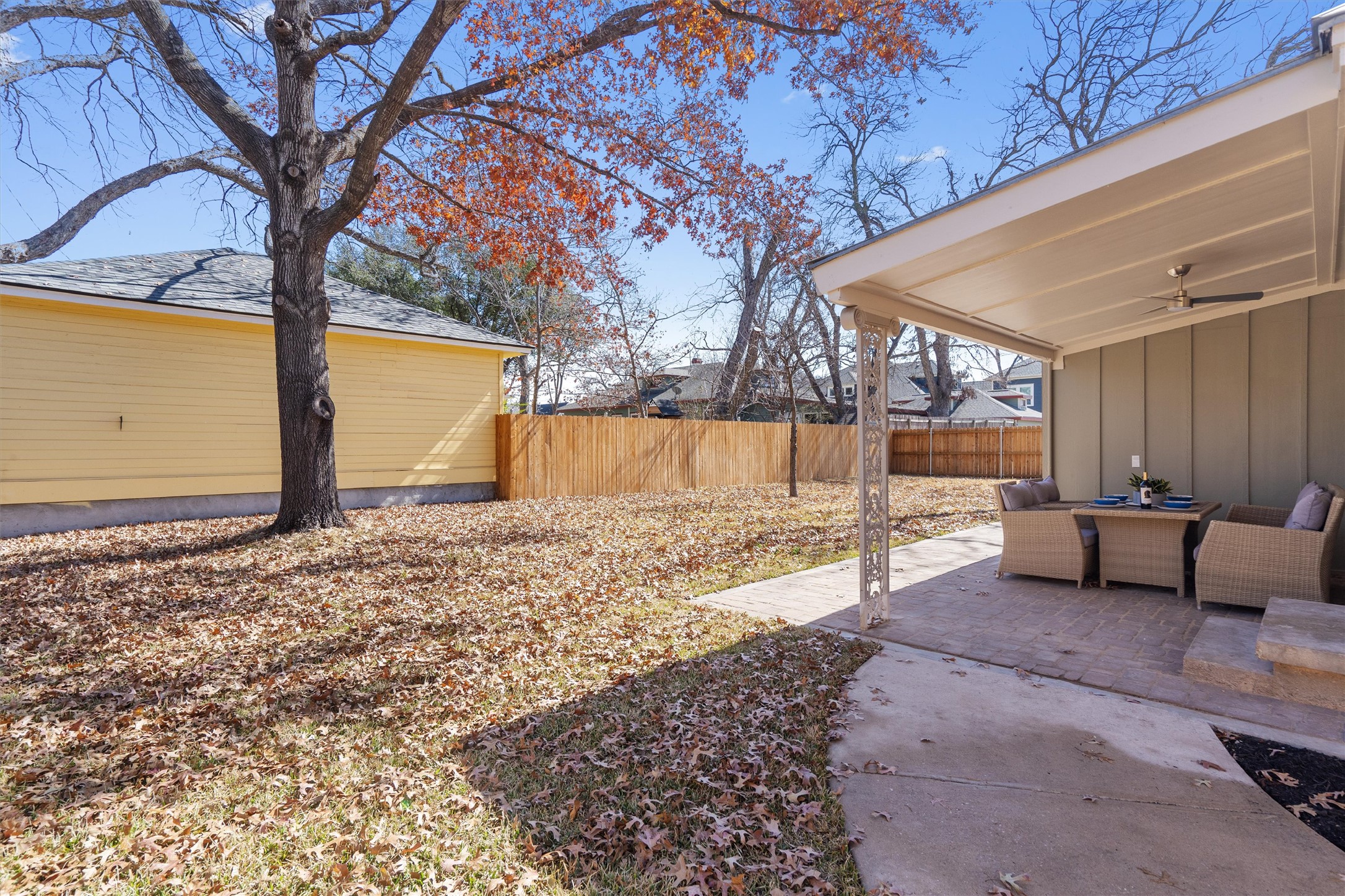 1605 South Austin Avenue Georgetown, TX 78626 - Photo 29 of 40 Fenced yard featuring a ceiling fan, a patio area, and outdoor lounge area