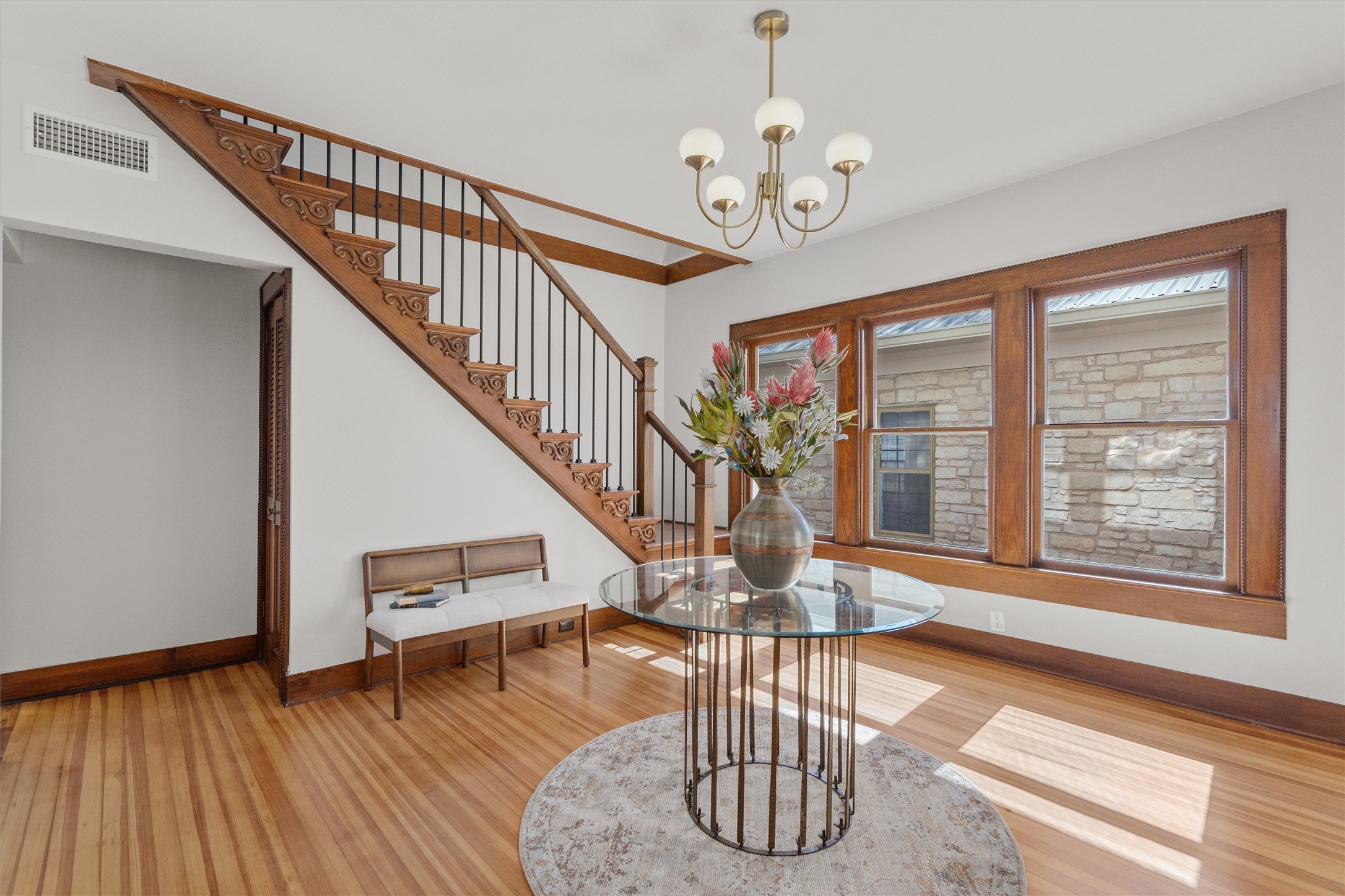 1605 South Austin Avenue Georgetown, TX 78626 - Photo 4 of 40 Foyer entrance featuring suspended lighting and wood finished floors