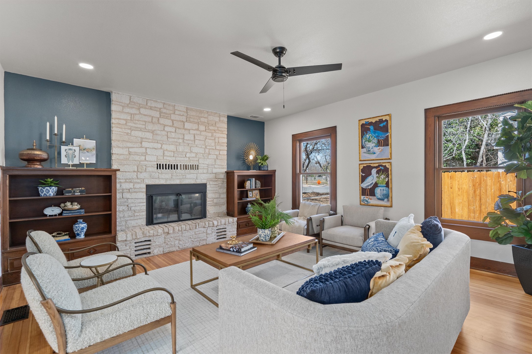 1605 South Austin Avenue Georgetown, TX 78626 - Photo 8 of 40 Living room featuring light wood-style floors, a stone fireplace, ceiling fan, plenty of natural light, and recessed lighting