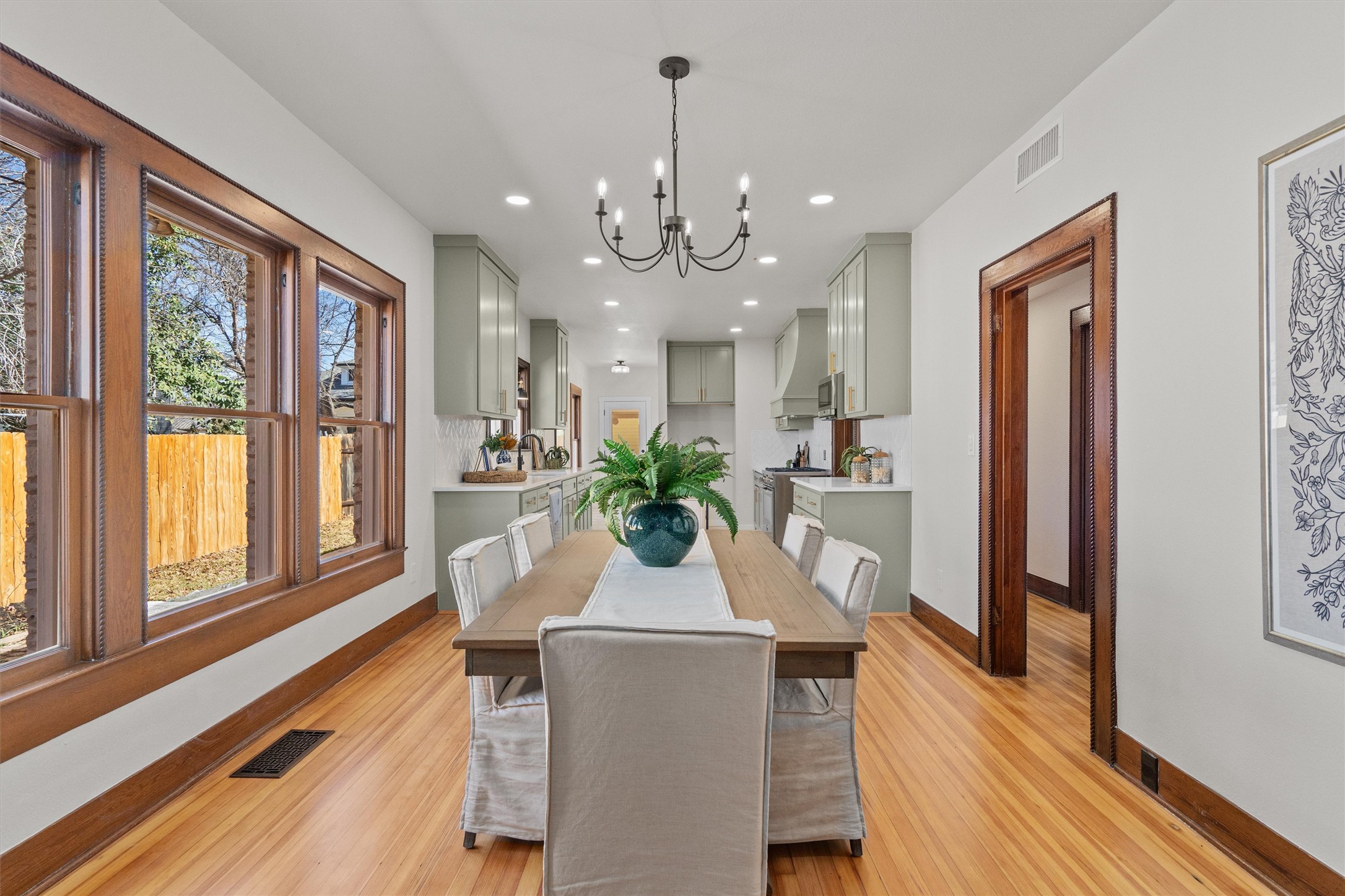 1605 South Austin Avenue Georgetown, TX 78626 - Photo 9 of 40 Dining area featuring a chandelier and light wood-style flooring